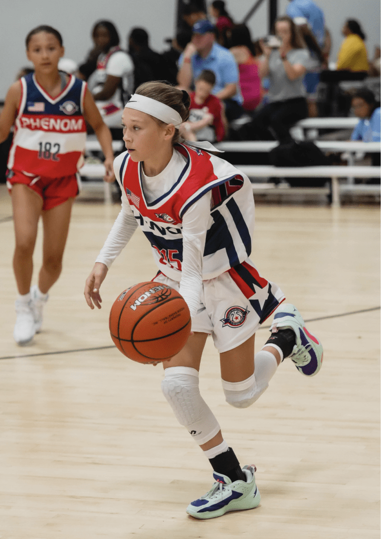 Youth basketball player dribbling the ball during a game.