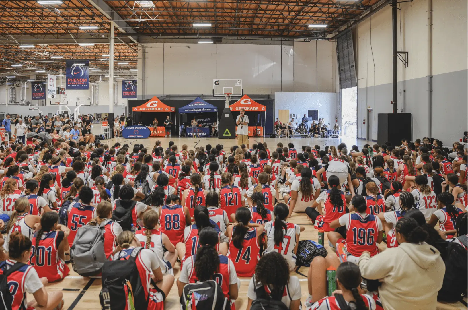 Basketball coach addressing young players.