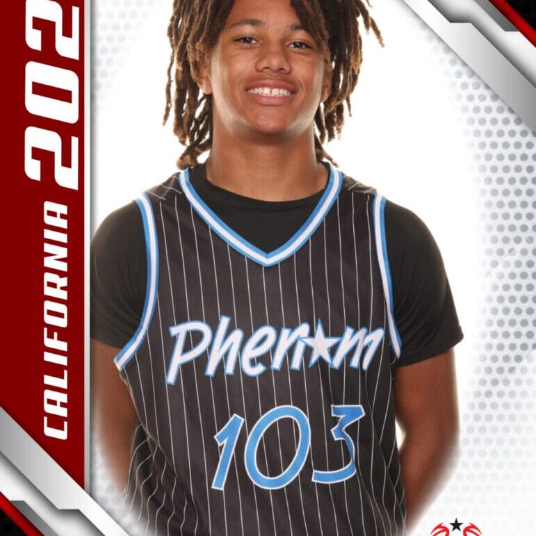 Young basketball player in Phenom jersey number 103 posing confidently.