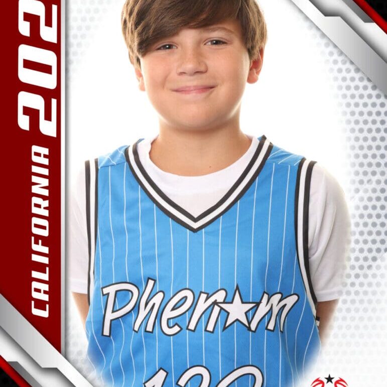 Young basketball player in a blue Phenom jersey.