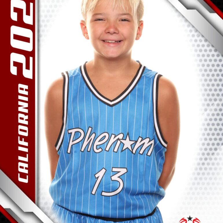 Young boy smiling in a blue Phoenix basketball jersey.