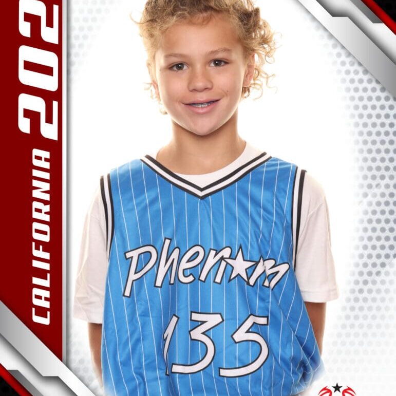 Young basketball player in a blue Phoenix jersey smiling.