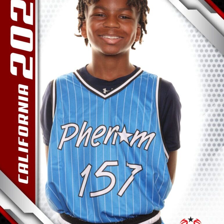 Young basketball player in a blue Phoenix jersey smiling confidently.