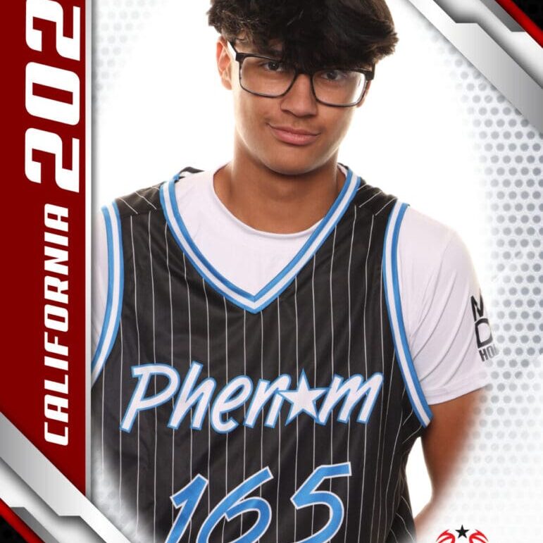 Young man in a sports jersey posing confidently.