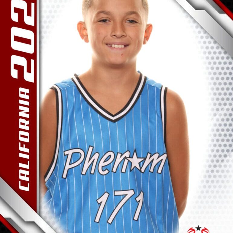 Young basketball player in blue jersey posing for a photo.