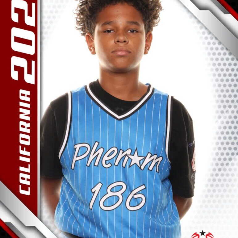Young basketball player in a blue Phoenix jersey posing confidently.