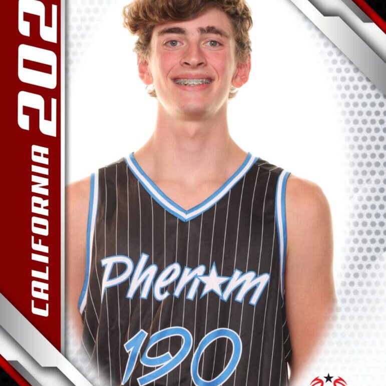 Young basketball player in a black Phenom 190 jersey.