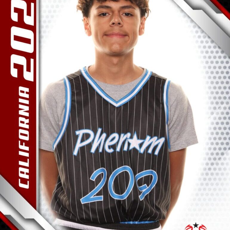 Young basketball player in a Phenom 202 jersey poses for a photo.