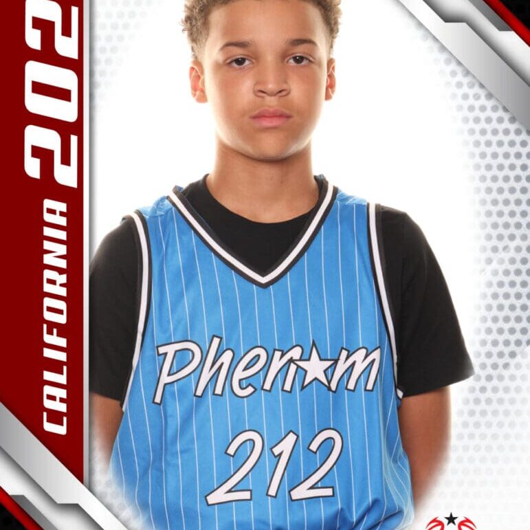 Young basketball player in a blue jersey posing for a sports portrait.