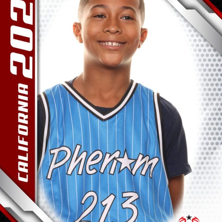 Young basketball player in a blue jersey smiling.