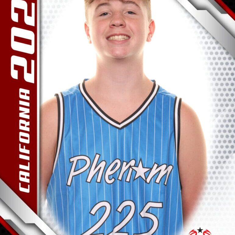 Smiling young basketball player in a blue Pherom 225 jersey.