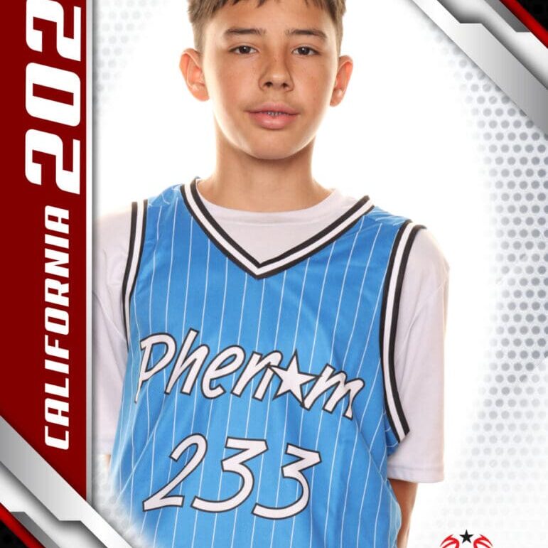 Teen basketball player in blue jersey posing for a portrait.