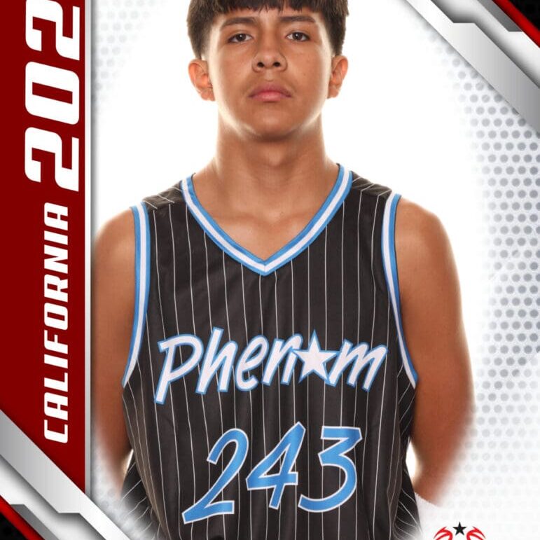 Young basketball player in a Phenom jersey posing for a photo.