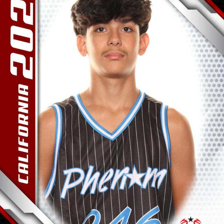 High school basketball player in a Phantom jersey posing for a portrait.