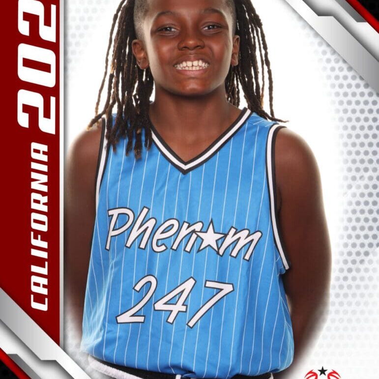 A young basketball player in a blue Phantom 247 jersey smiles confidently.
