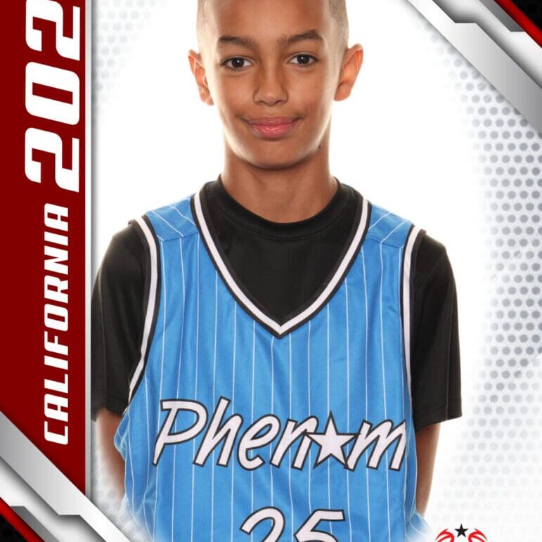 Young basketball player in a Phenom jersey posing for a sports card.
