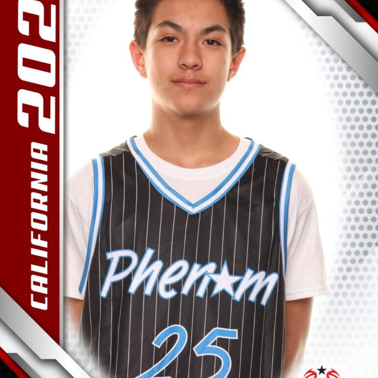 Young basketball player in a Phenom jersey posing for a photo.