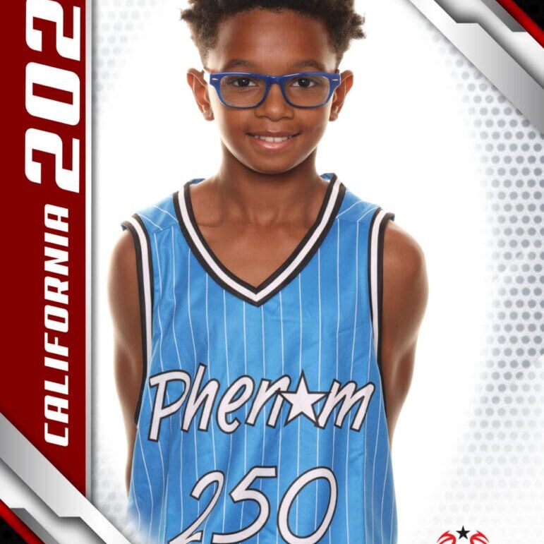 Young basketball player in blue jersey smiling confidently.