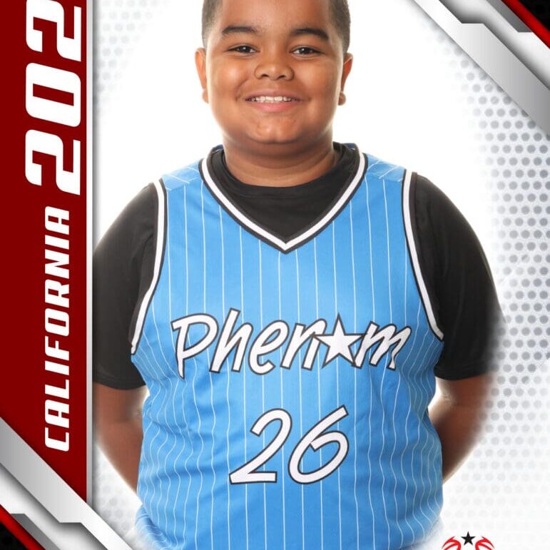 Young basketball player in a blue Pherom jersey smiling.
