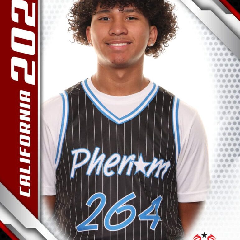 Young basketball player in a Phenom 264 jersey poses confidently.