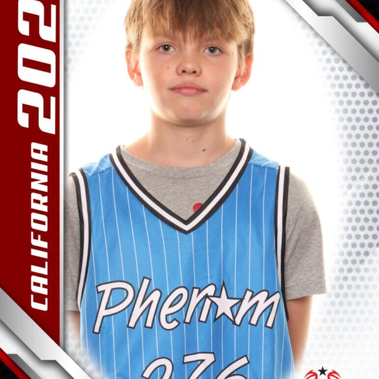 Young basketball player in a Phenom jersey posing for a portrait.