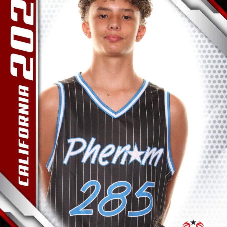 Young basketball player in a Phenom 285 jersey poses confidently.