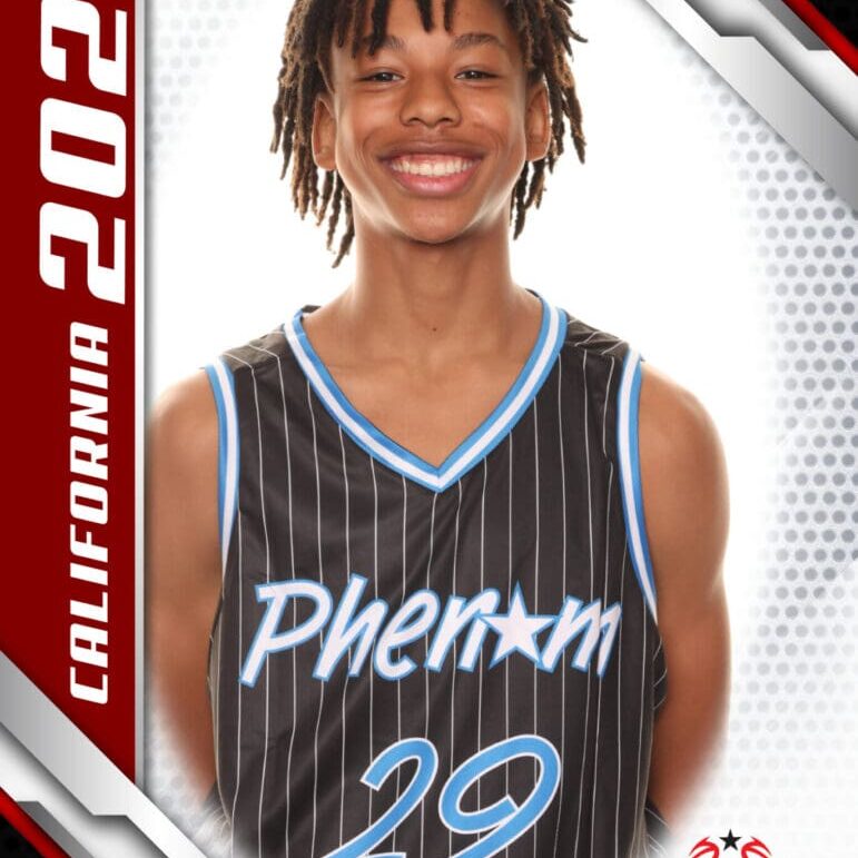 Young basketball player in a Phantom jersey smiling for a portrait.