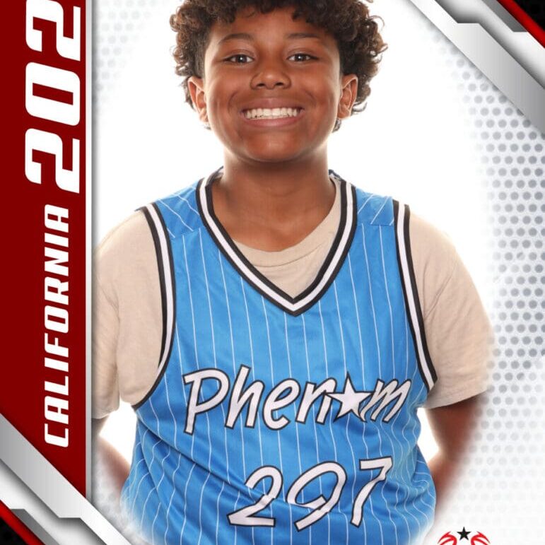 Smiling young basketball player in blue jersey posing for a team photo.