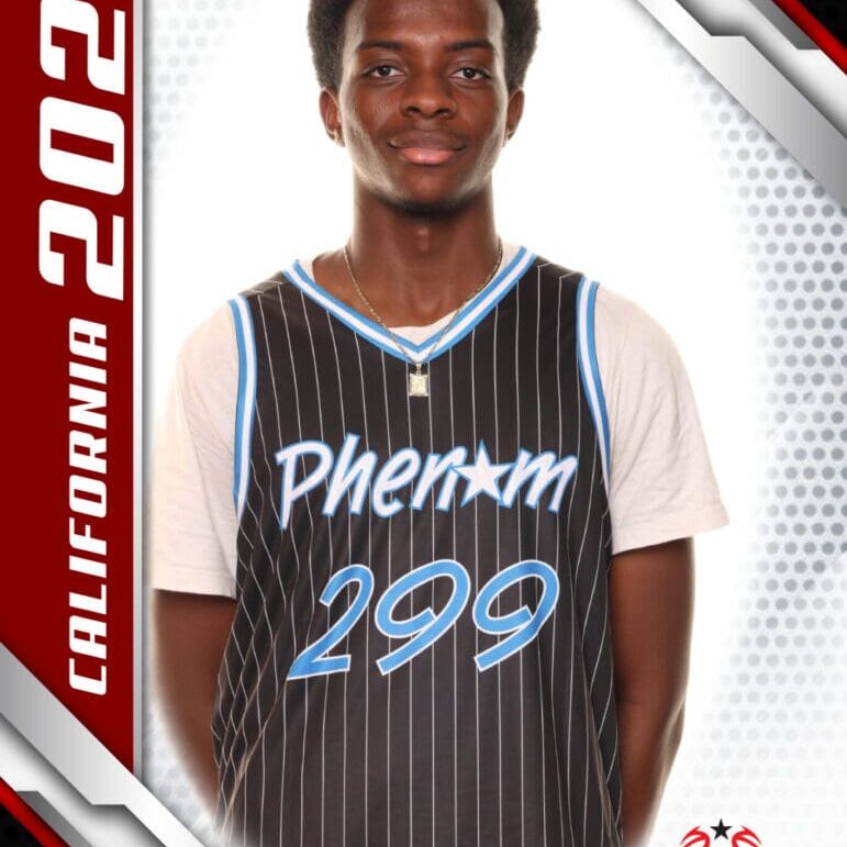 Basketball player in a Phenoms 299 jersey posing for a photo.