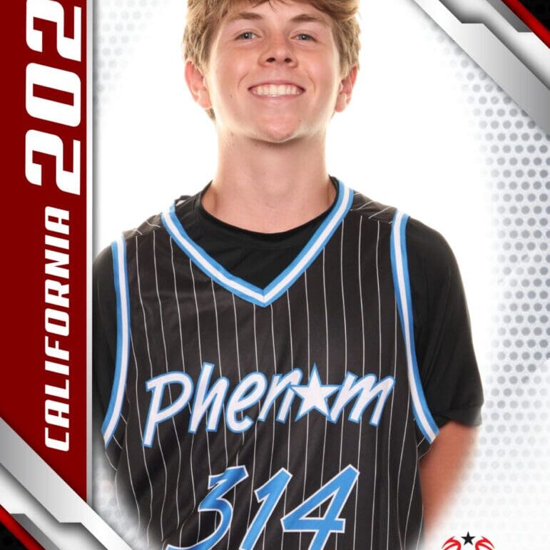 Young basketball player in a Phenom 314 jersey smiling for a photo.