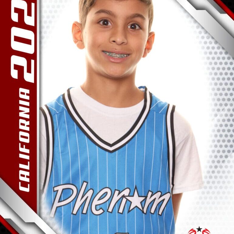 Young boy in a blue basketball jersey with 'Phenix' written on it.