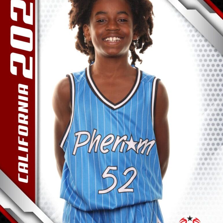 Young basketball player in blue Phoenix jersey number 52 smiles confidently.