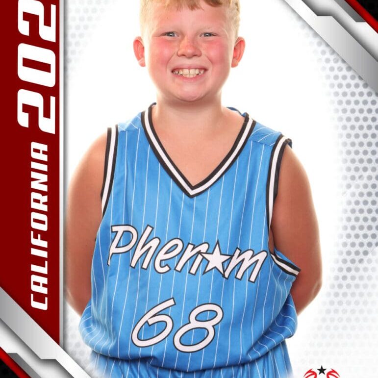 Young basketball player smiling in blue jersey.