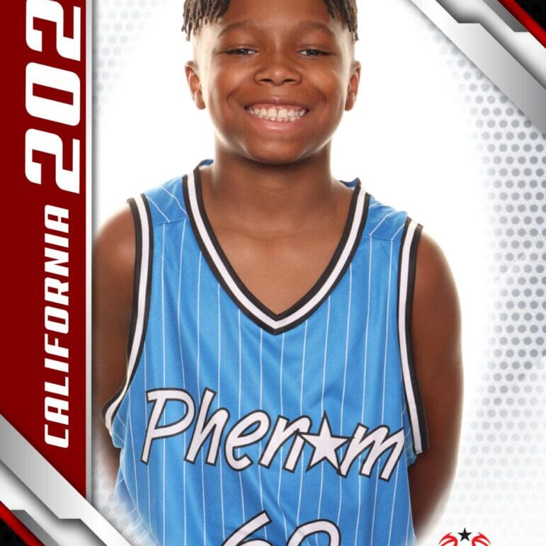 Smiling young basketball player in a blue jersey posing for a team photo.