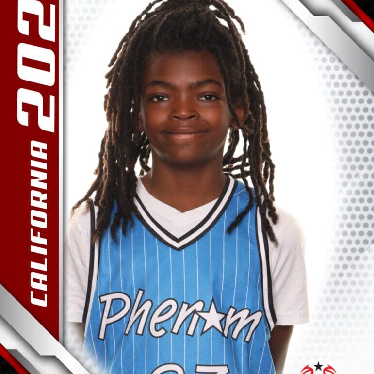 High school basketball player in a blue jersey with long dreadlocks.