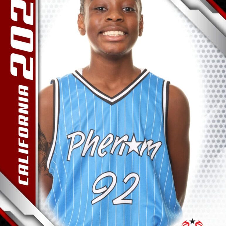 Young basketball player in a blue Phoenix jersey, smiling confidently.