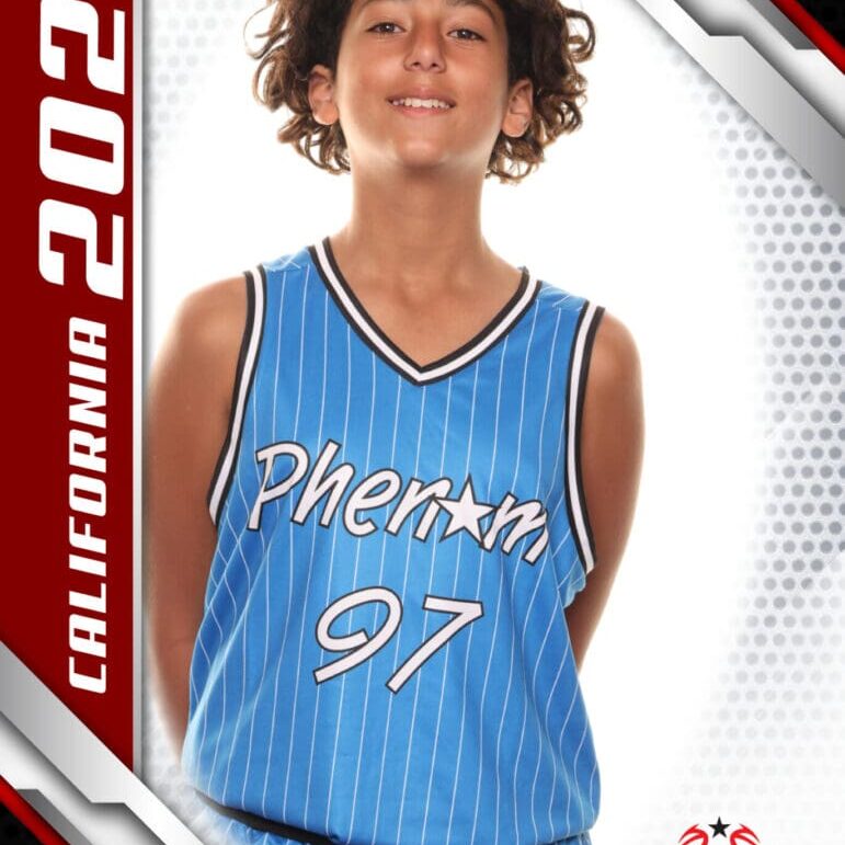Young basketball player in a blue Phoenix jersey smiling confidently.